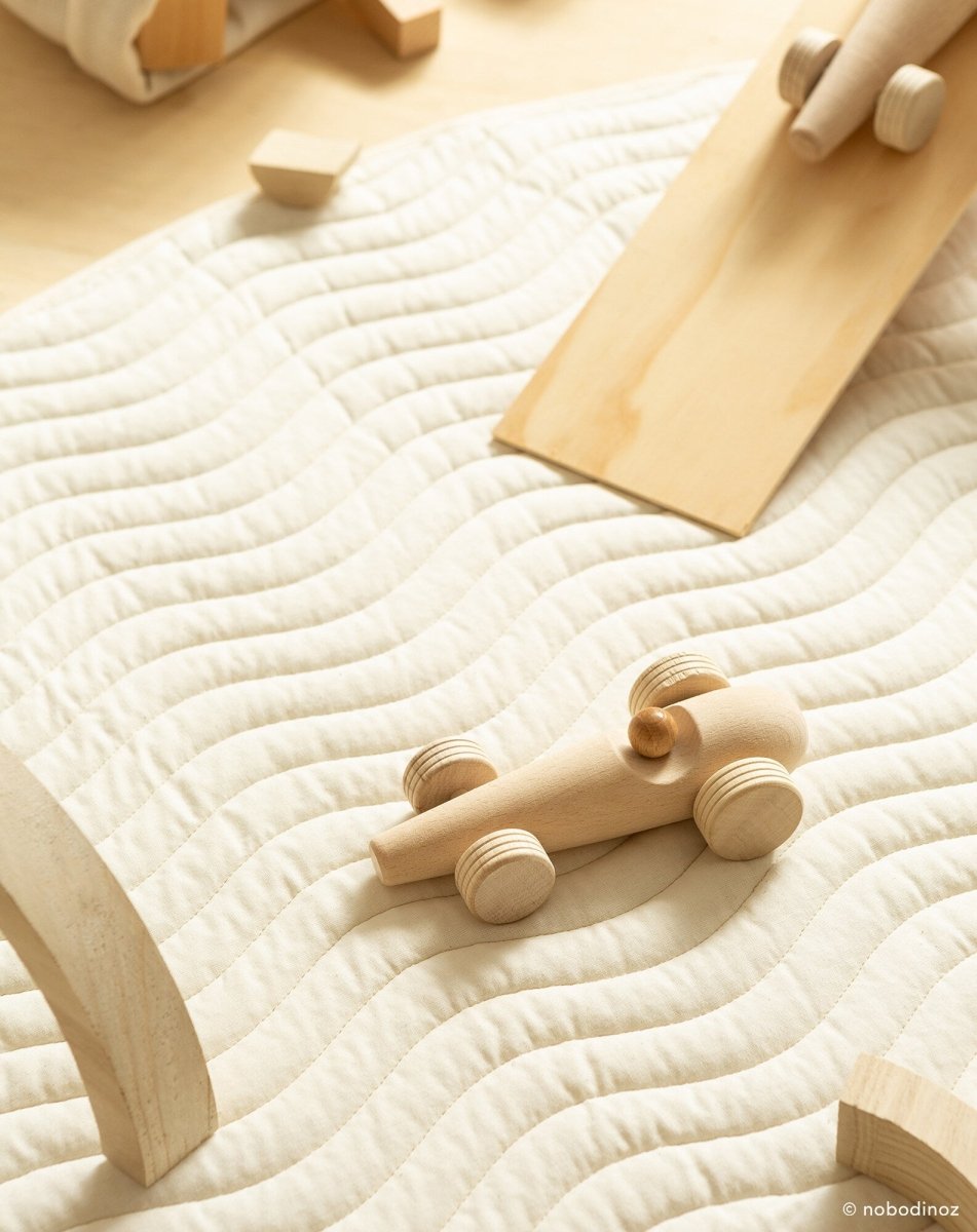 Nobodinoz Wooden Racing Car - Beech Wood, car on a play mat