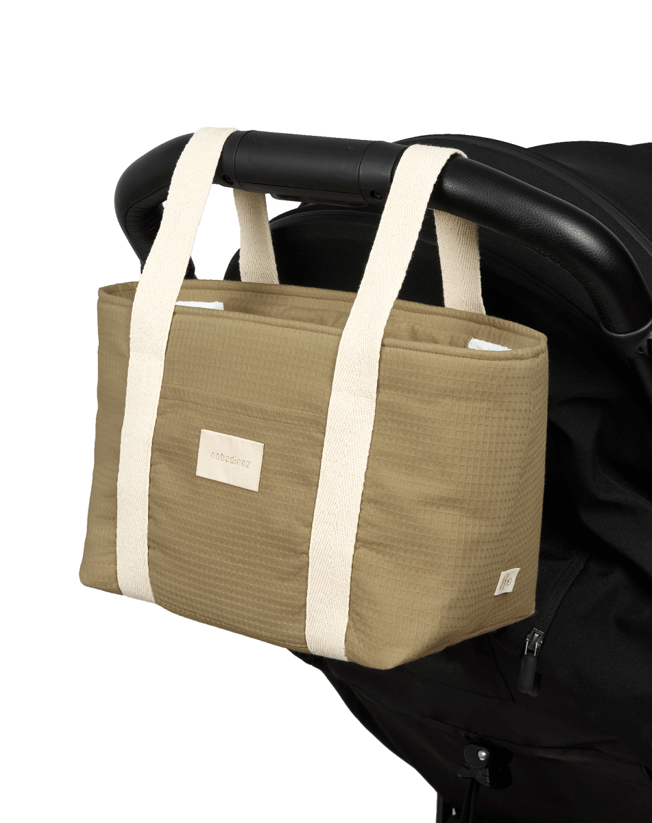 Nobodinoz Waterproof Stroller Organiser Opera - Olive Green, organiser attached to a stroller