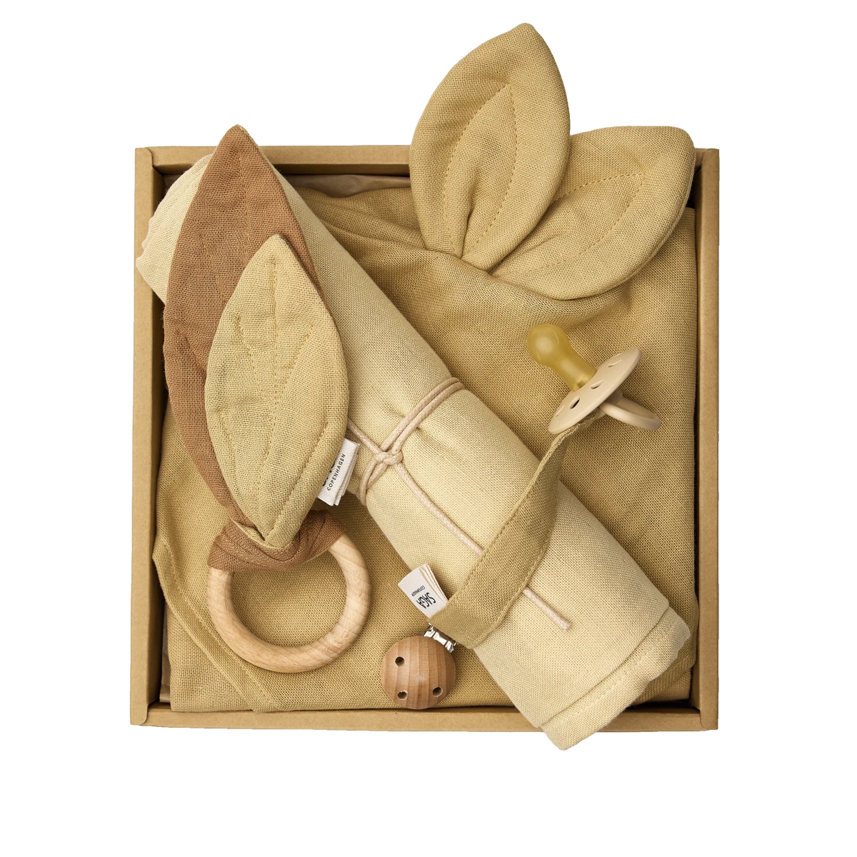 saga copenhagen baby gift box bumblebee, open box from above with swaddle, cuddle cloth, teething ring and pacifier clip in honey tones
