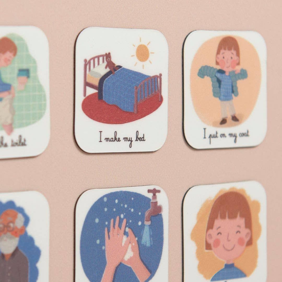 magnets faire son lit et mettre son manteau sur un tableau rose