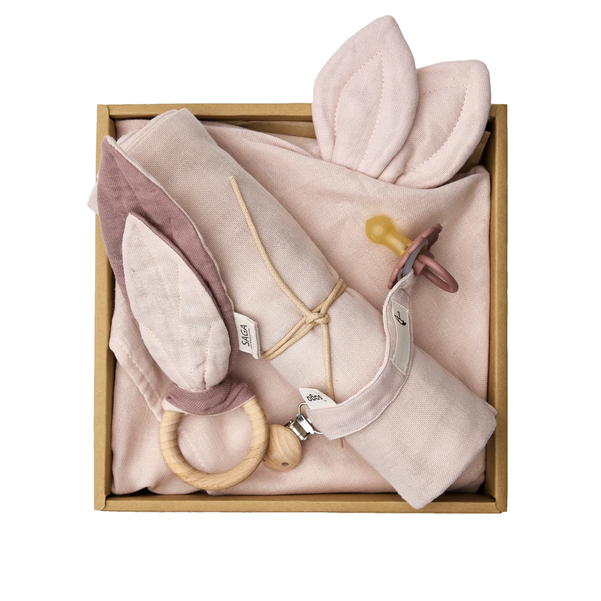 saga copenhagen baby gift box mellow rose, open box from above with swaddle, cuddle cloth, teething ring and pacifier clip in misty rose