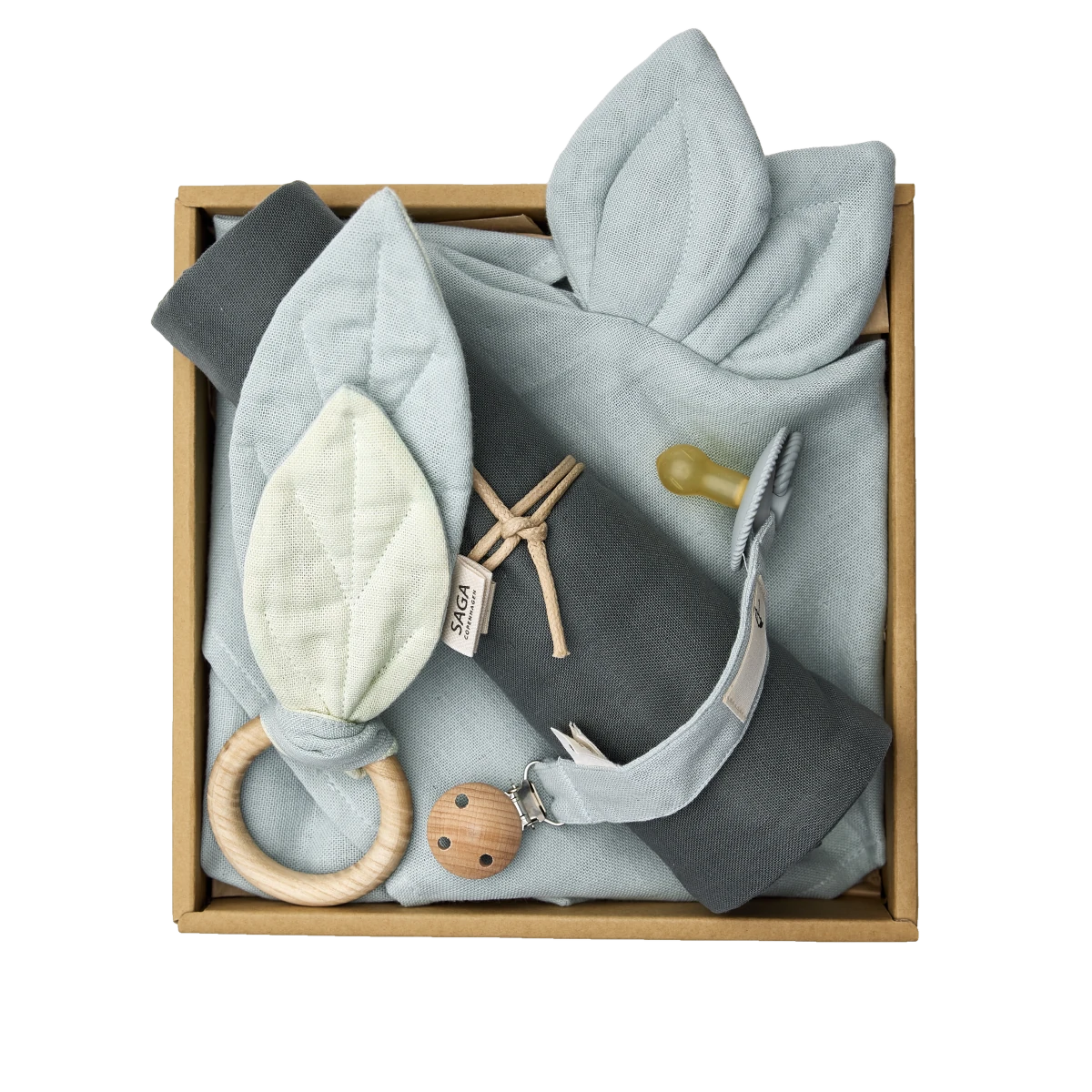 saga copenhagen baby gift box morning mist, open box from above with swaddle, cuddle cloth, teething ring and pacifier clip in soft greens